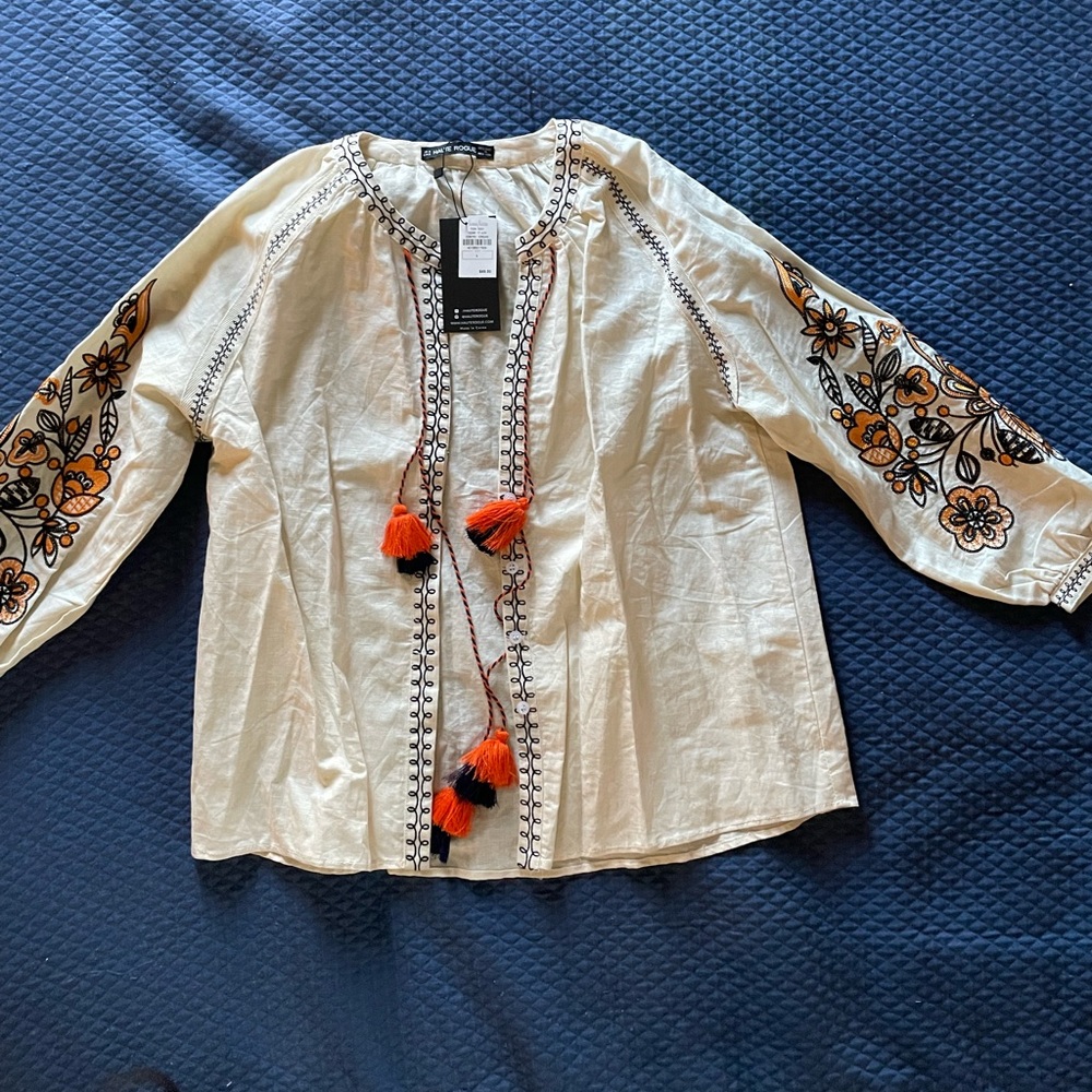 NWT boho blouse. Embroidered flower detail on sleeves